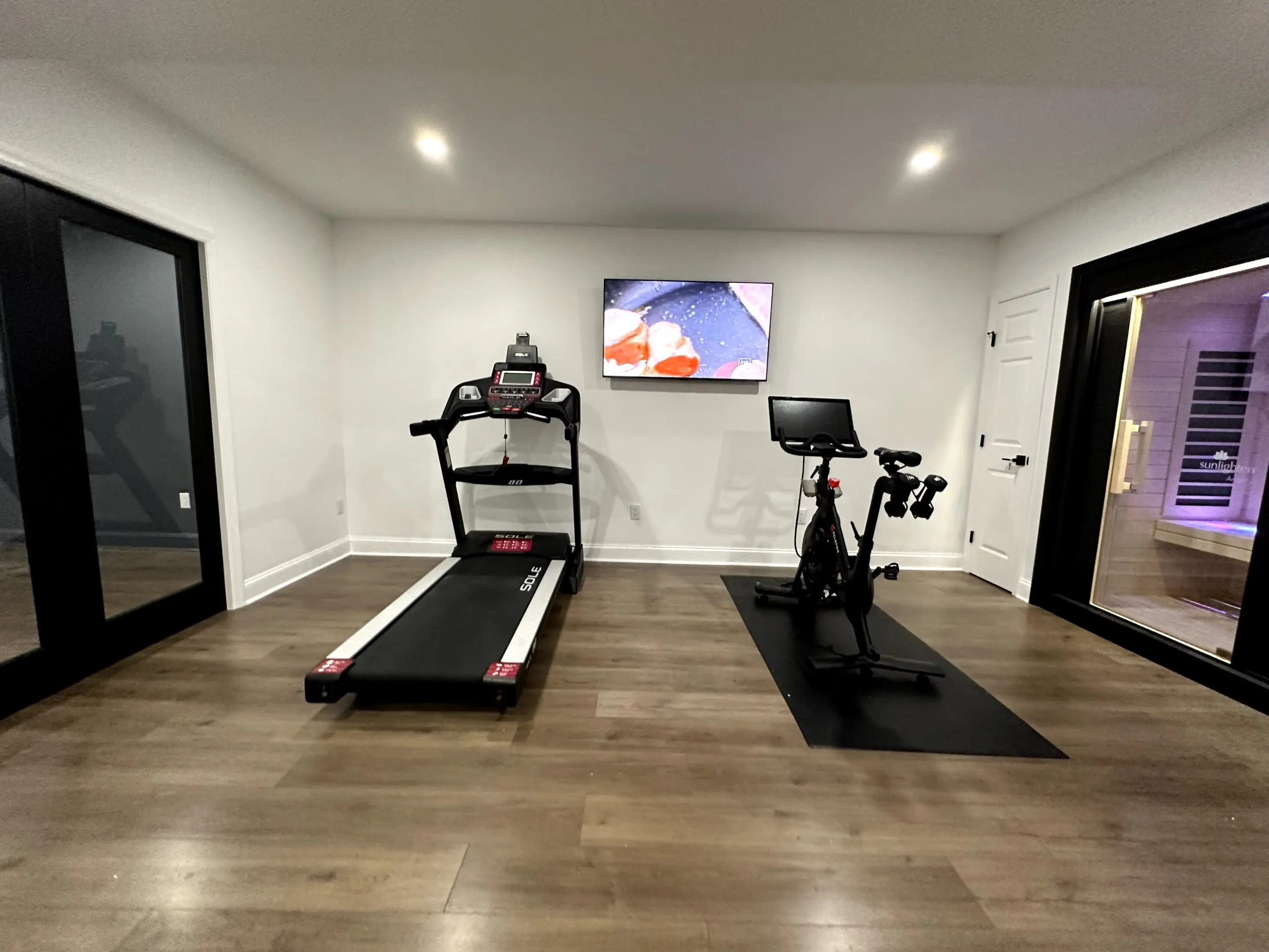 Home gym with treadmill and exercise bike